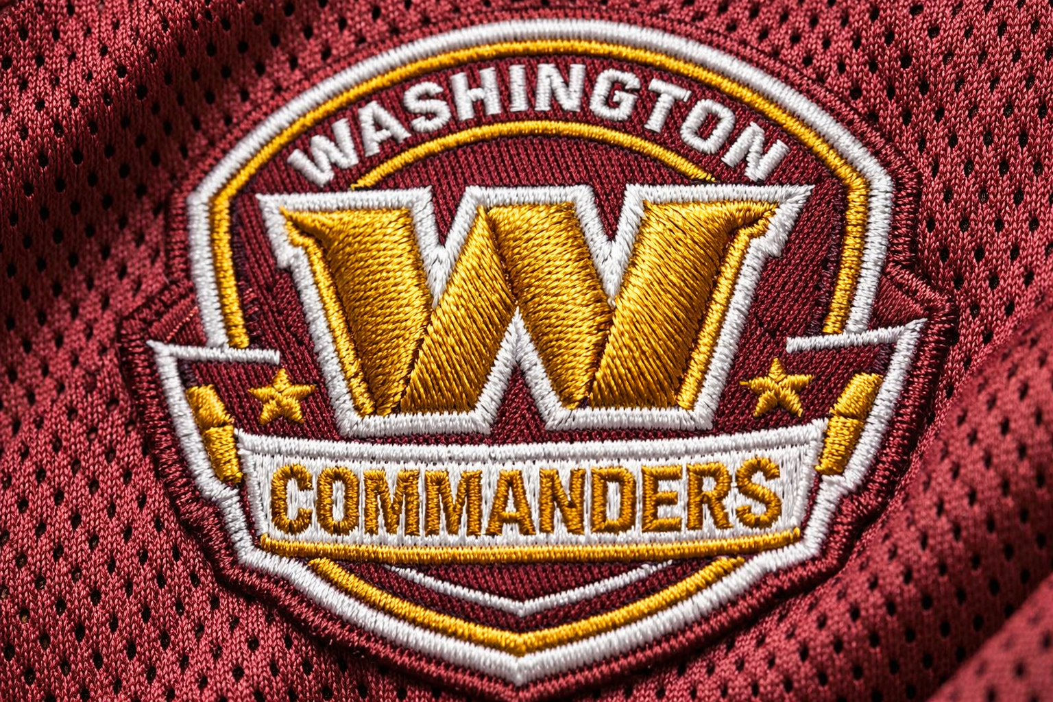 Close up of the Washington Commanders logo embroidered on a jersey sleeve