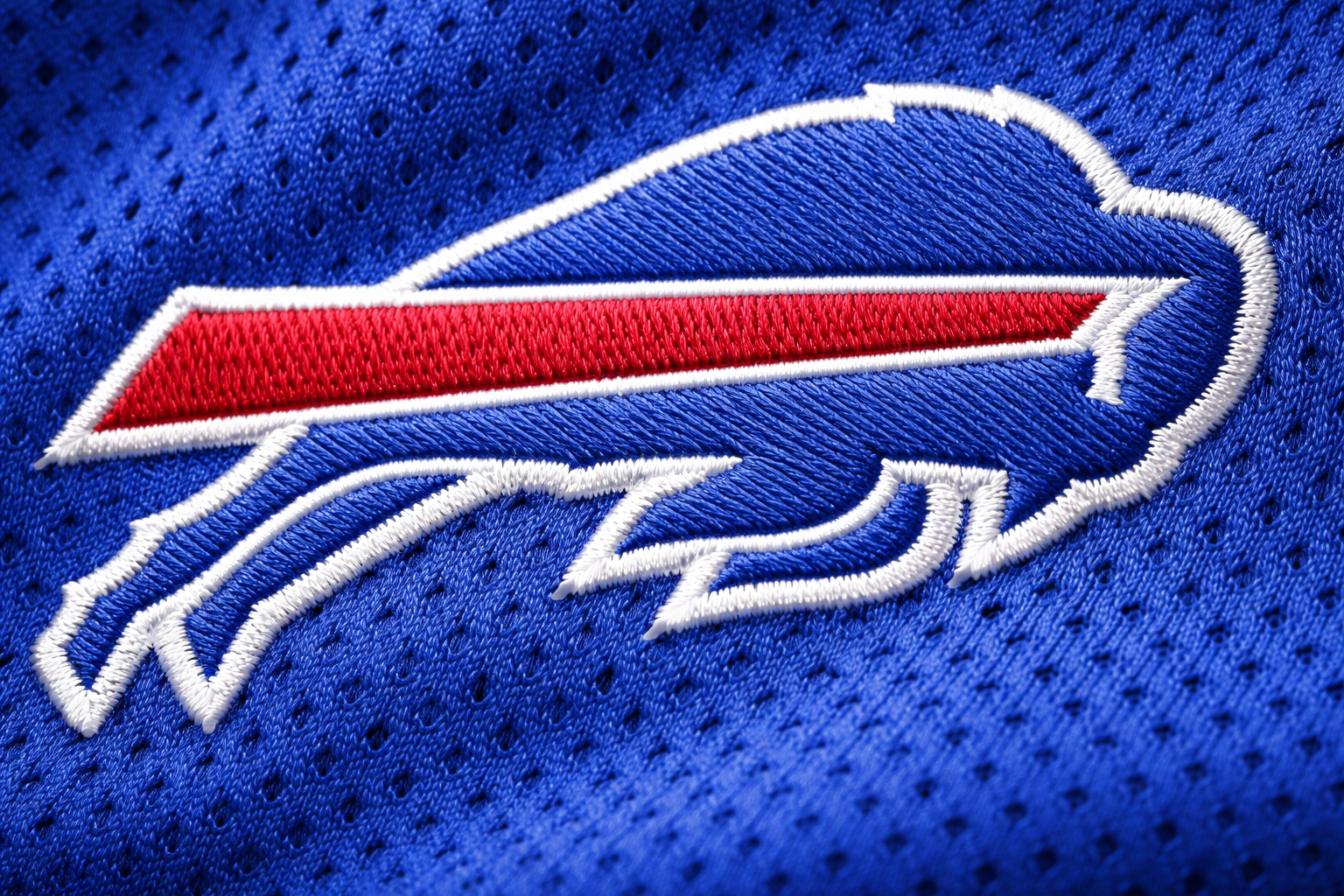 Macro close up of the red and white stitched stripes on a Buffalo Bills jersey sleeve