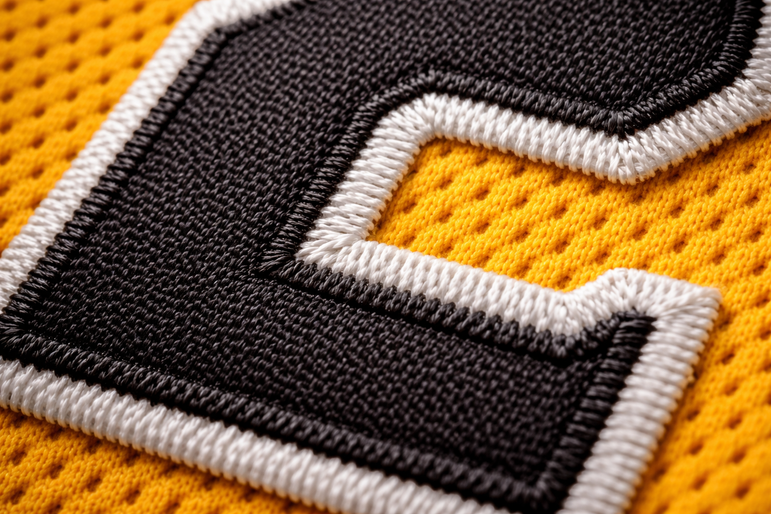 Roberto Clemente Jersey: A Guide to the Pirates Legend 3 Close up of stitched tackle twill number 21 on a Pirates jersey.