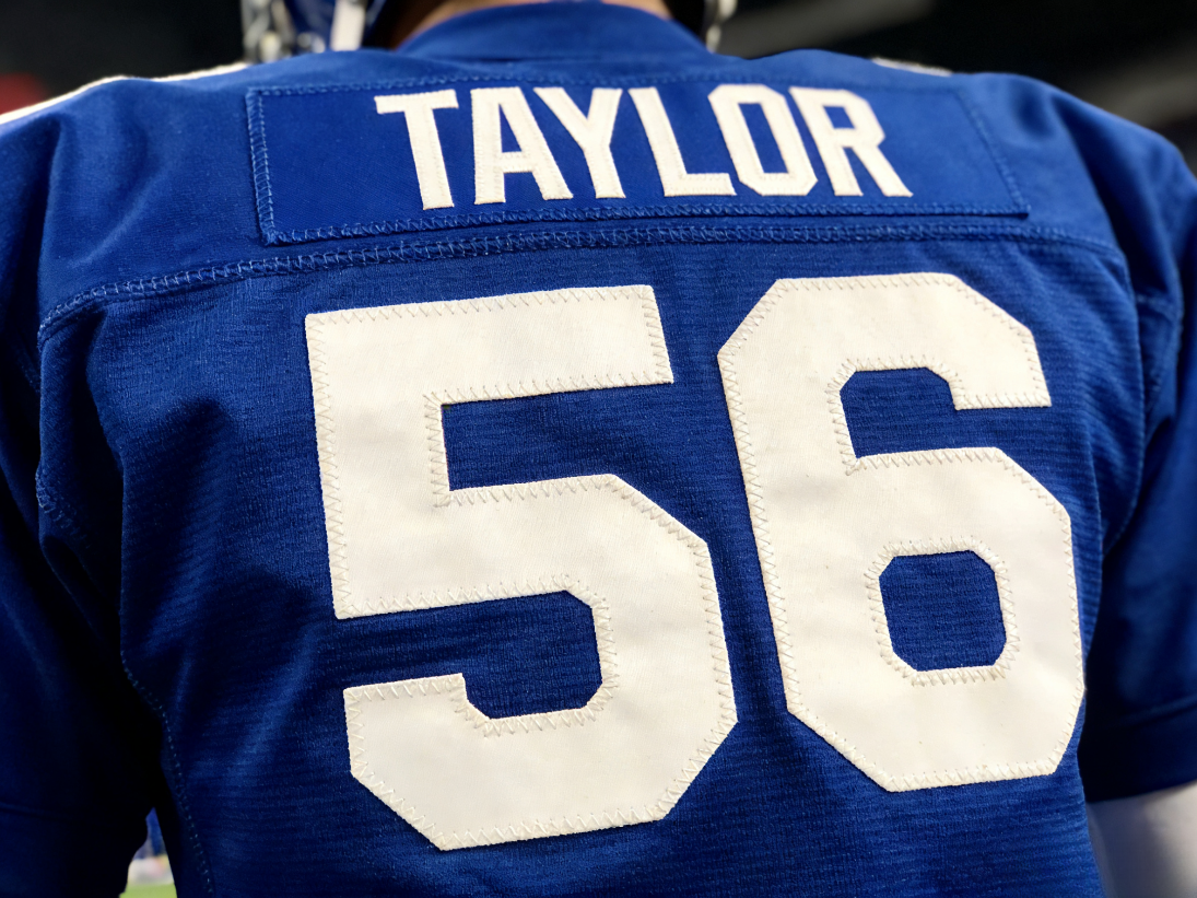 NY Giants Jersey: Shop Stitched Big Blue Wrecking Crew Gear 3 Close up of the number 56 and Taylor nameplate on a vintage Giants jersey