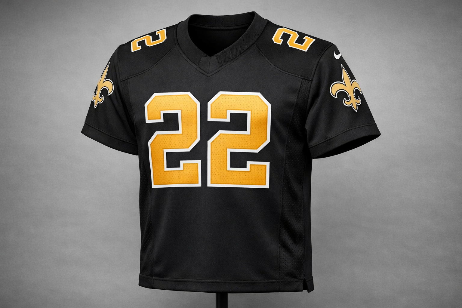 Black New Orleans Saints jersey with gold stitched numbers and Fleur-de-lis logo.