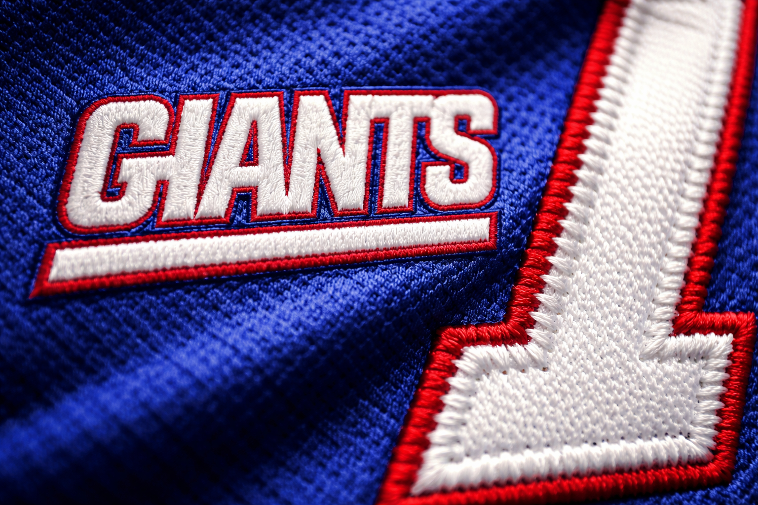 NY Giants Jersey: Shop Stitched Big Blue Wrecking Crew Gear 4 Macro close up of the GIANTS logo and stitched numbers