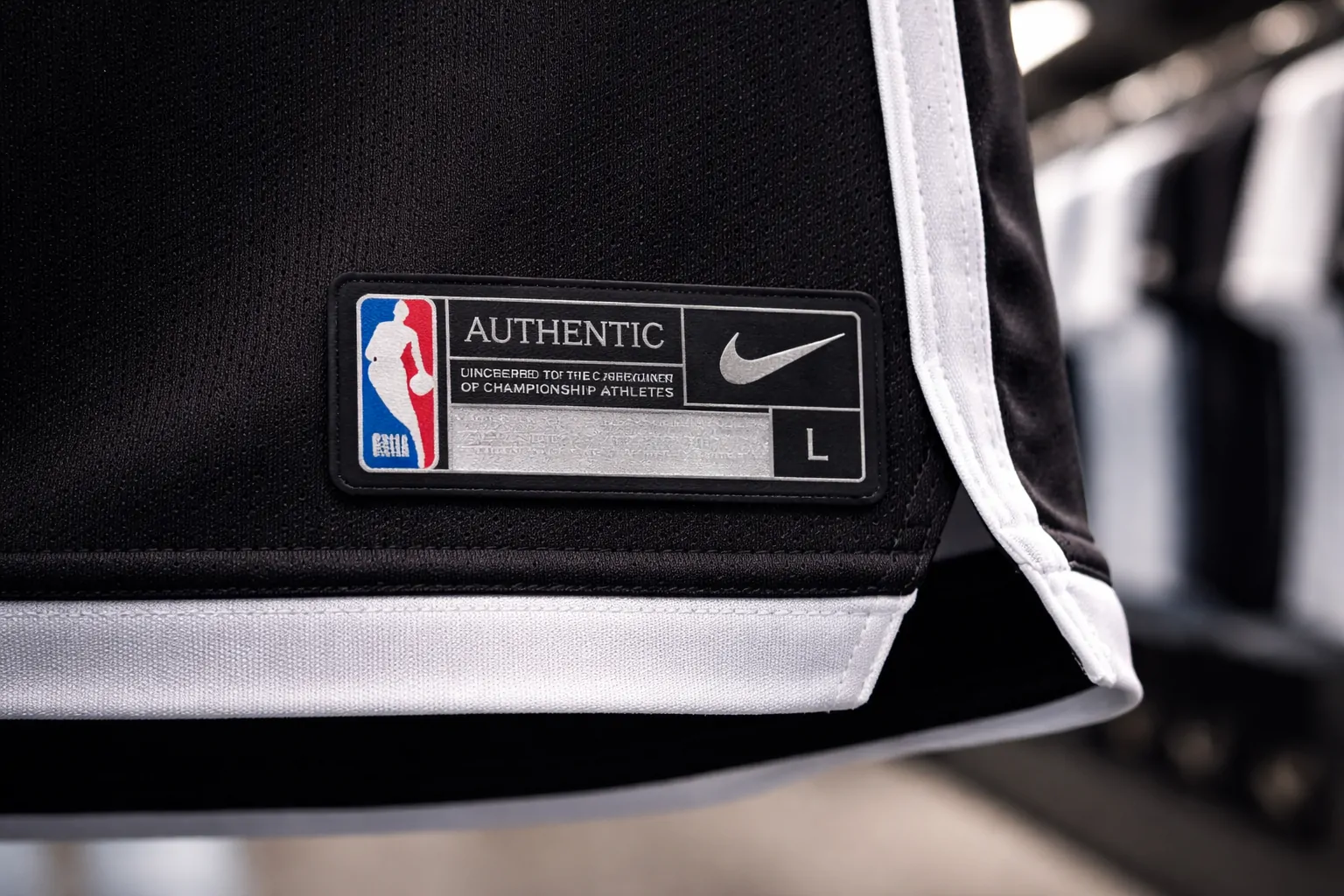 Authentic-style sewn-on jock tag at the bottom of a Ujersery replica