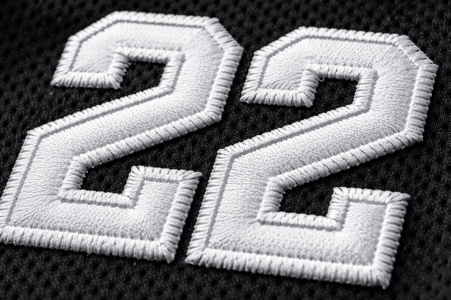 Custom Softball Jerseys: Stitched Gear for Beer Leagues 3 Macro close up of stitched tackle twill numbers on a custom softball jersey