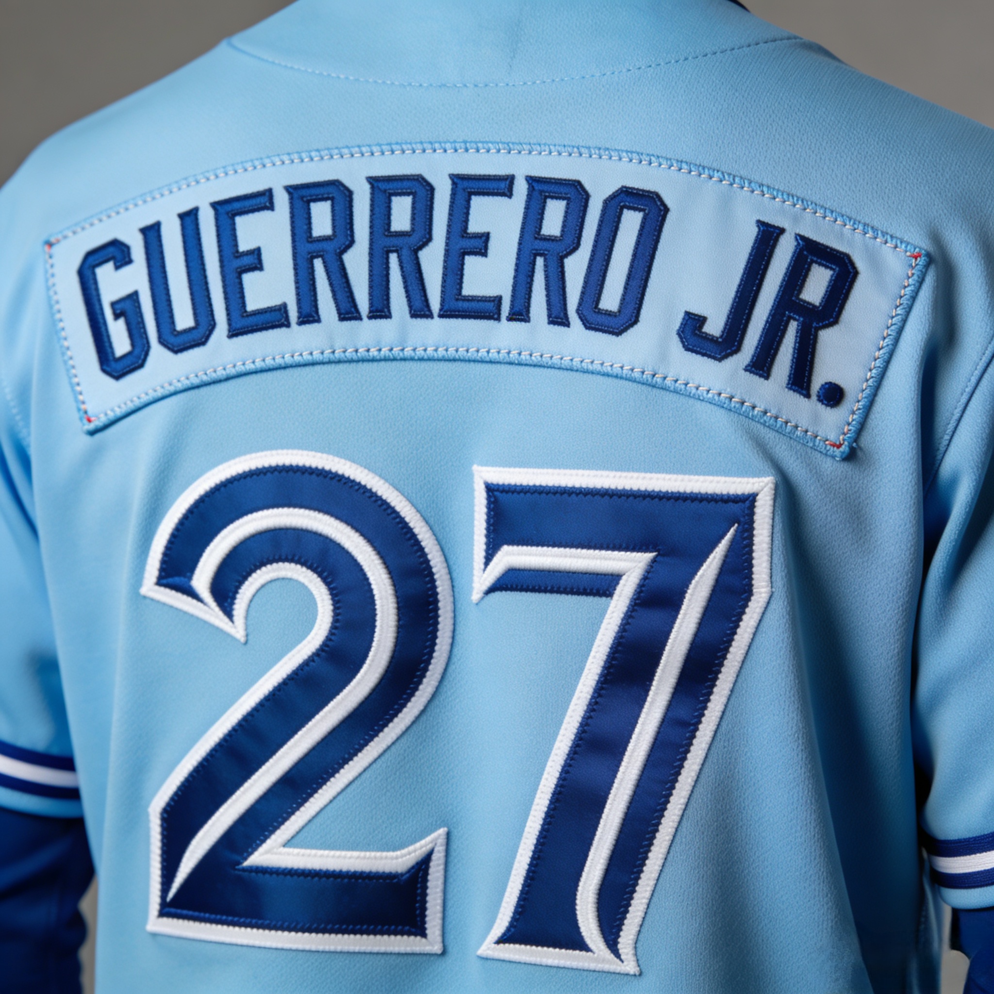 Toronto Blue Jays Jersey: Representing Canada in Blue 3 Back view of a Vladimir Guerrero Jr. #27 Blue Jays jersey with stitched nameplate.