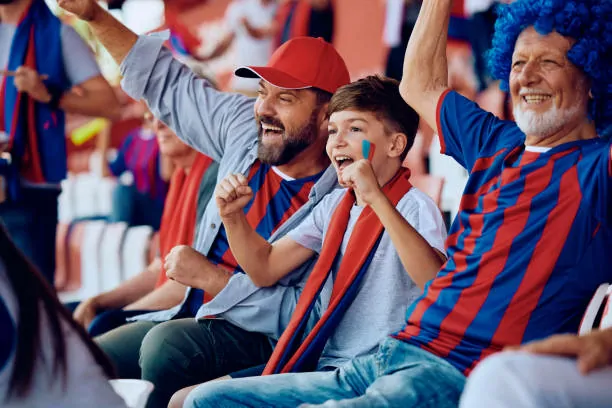 Family wearing matching personalized sports jerseys at a stadium