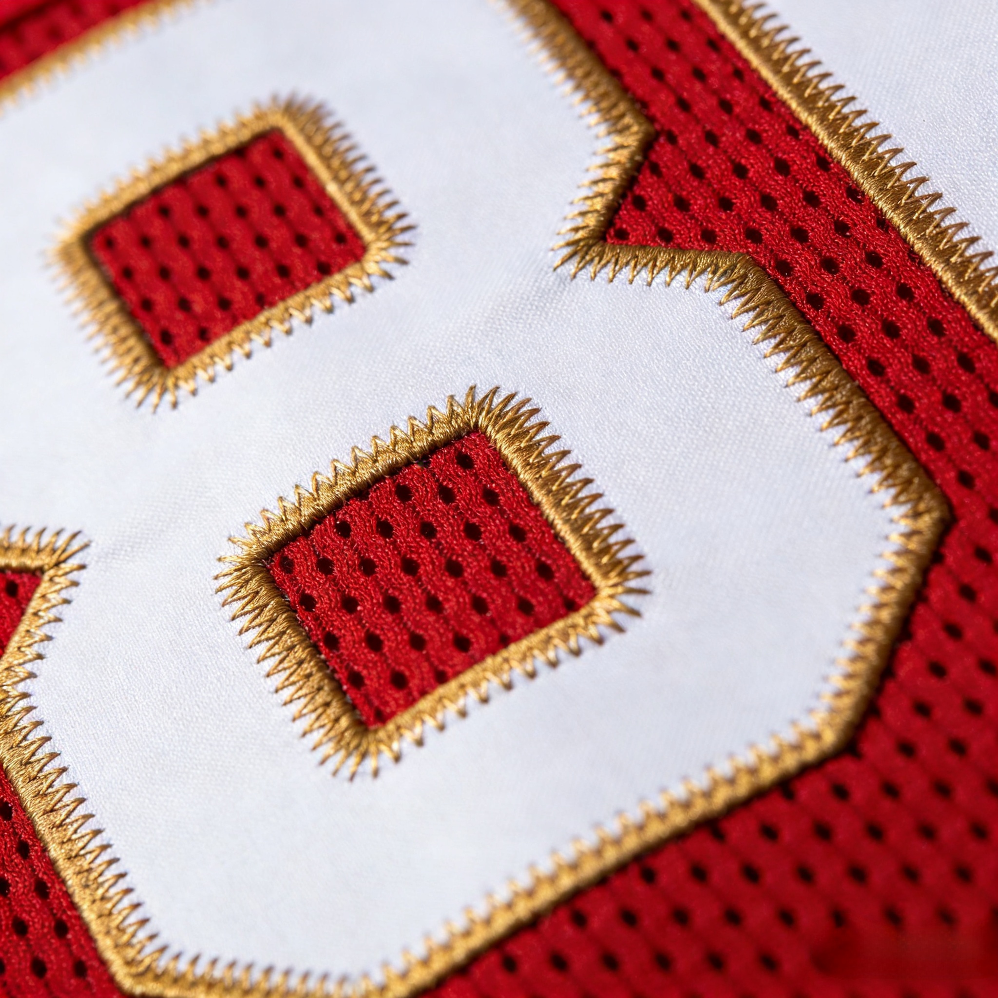 Travis Kelce Jersey: The Ultimate Guide to Stitched Chiefs Gear 3 Macro close up of stitched tackle twill on a Travis Kelce jersey.