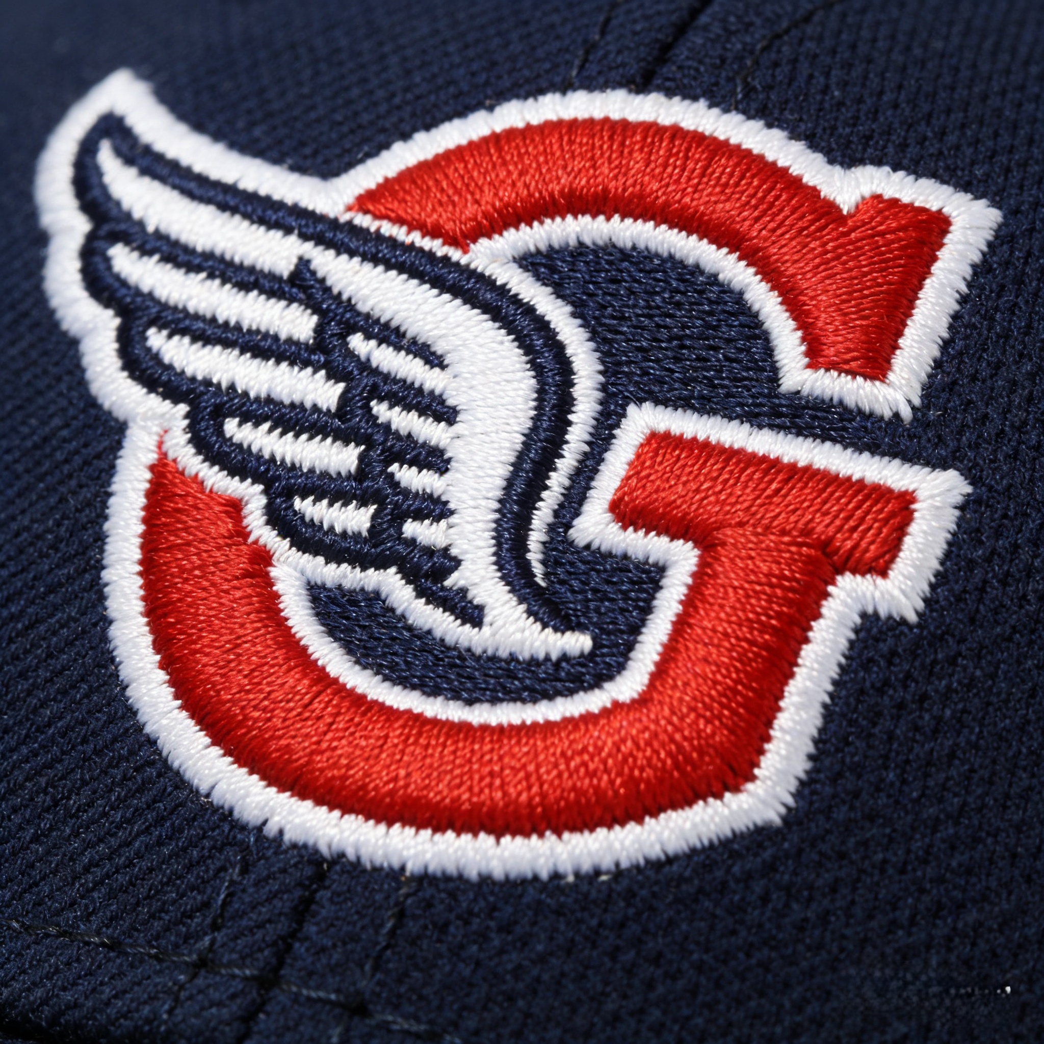 Macro close up of the winged G logo stitched on a Cleveland Guardians jersey