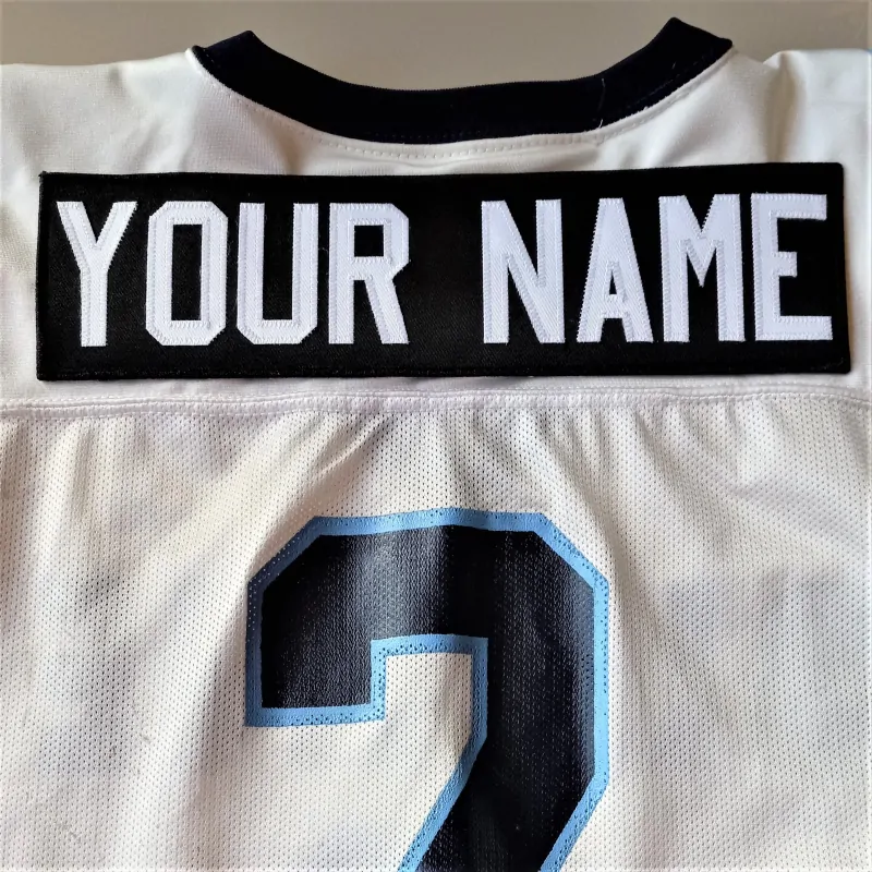 Close-up of premium stitched nameplate on a custom sports jersey