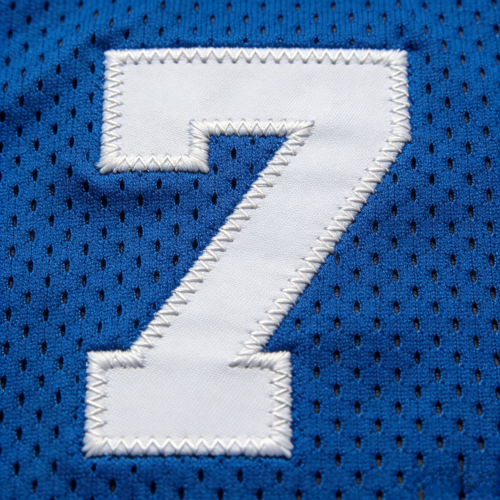 Macro close up of stitched tackle twill on a Mavericks jersey