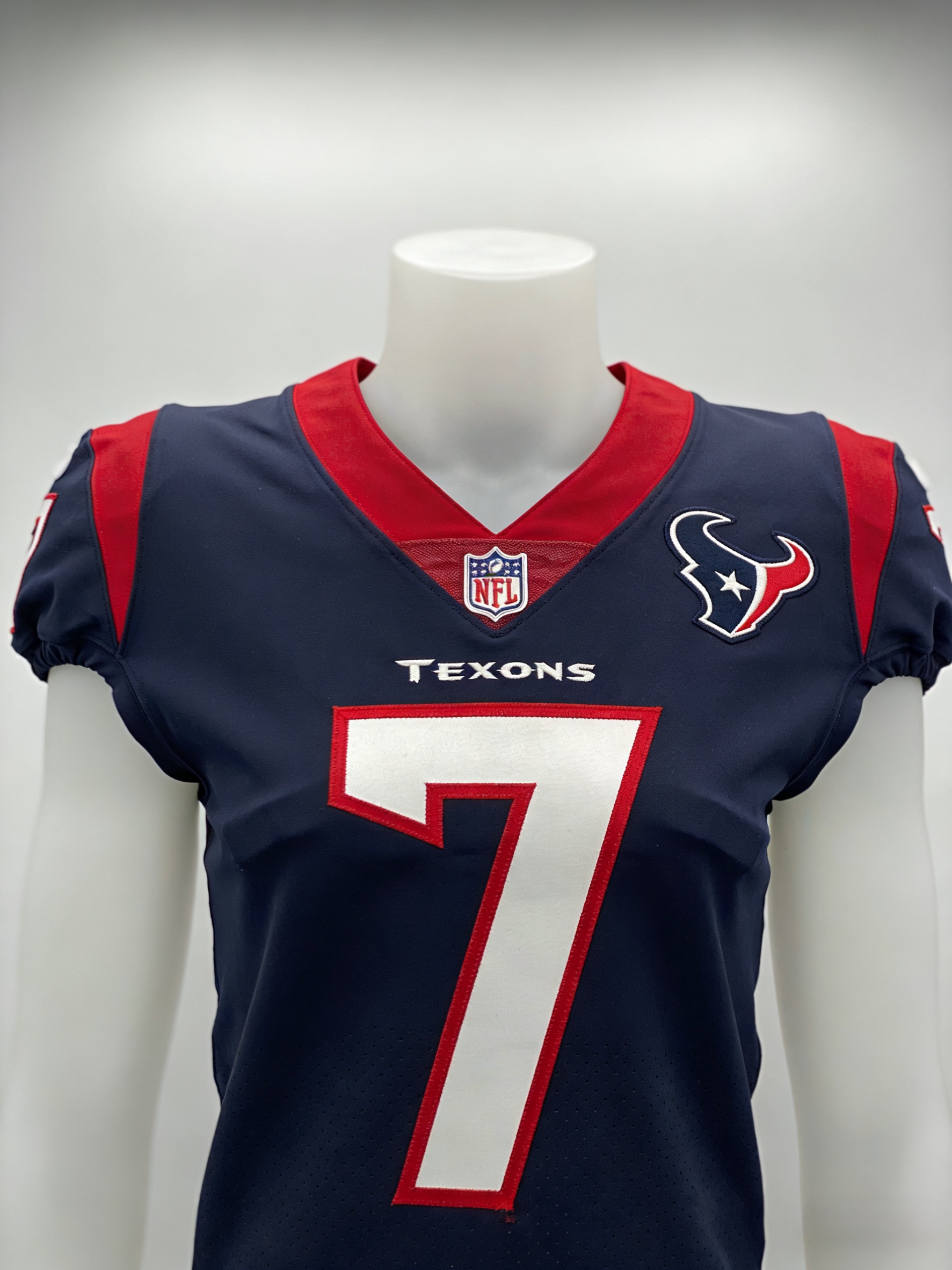 Stitched navy blue Houston Texans jersey with red accents and white numbers.