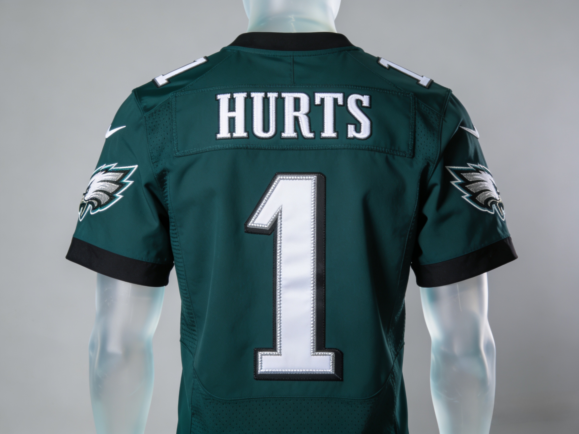 Stitched Midnight Green Jalen Hurts Philadelphia Eagles jersey front and back view.