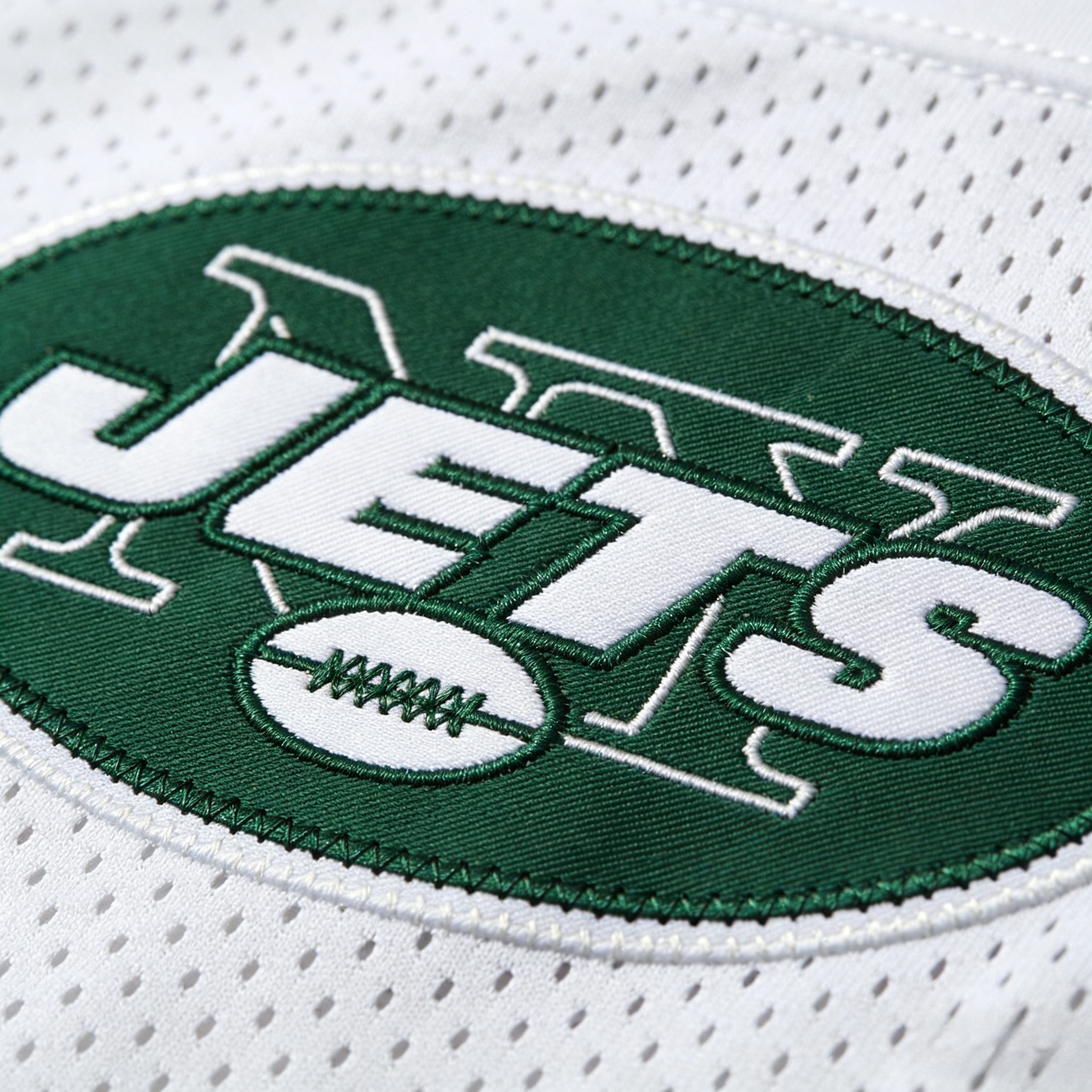 Close up of the stitched green and white New York Jets jersey logo.