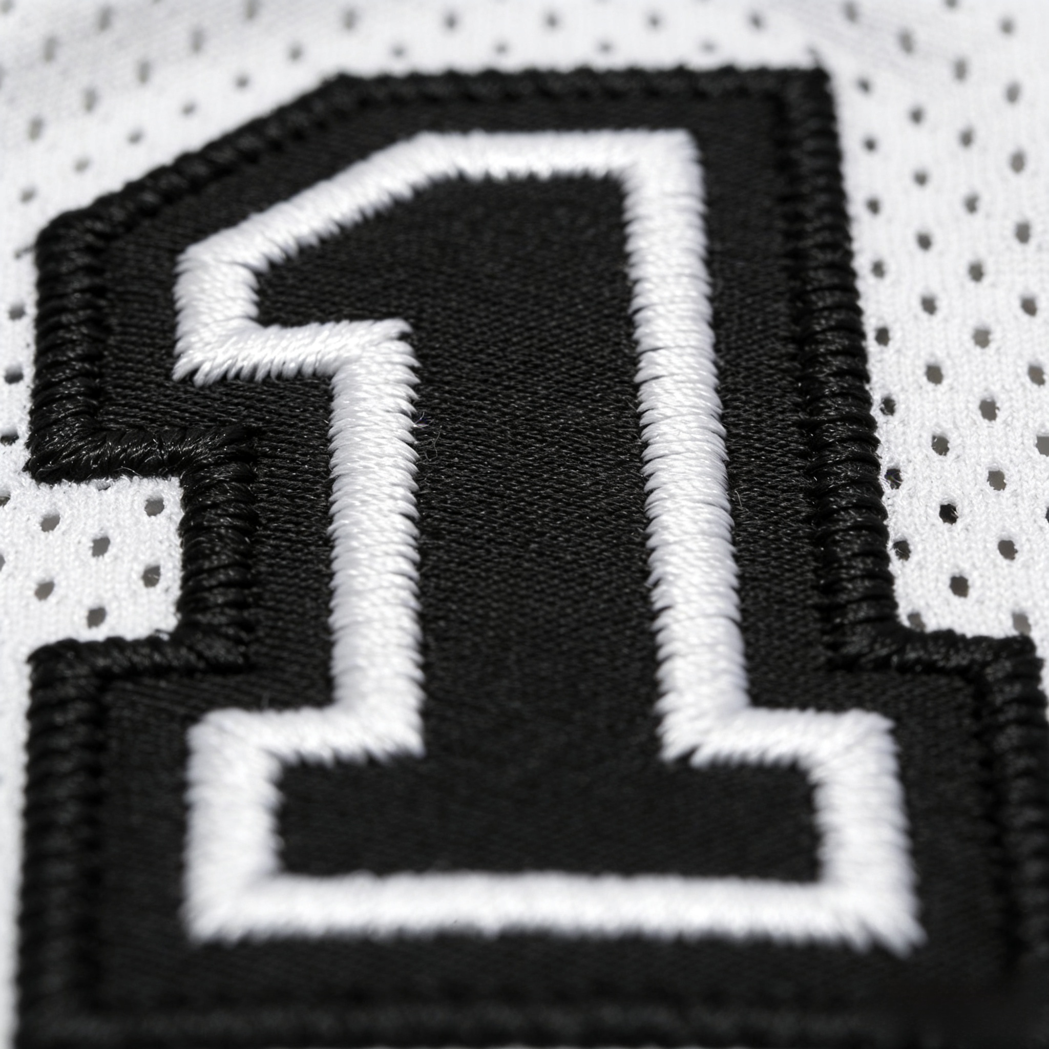 Macro close up of stitched tackle twill numbers on a Spurs jersey