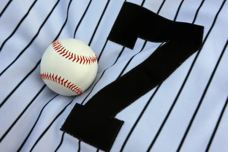 Custom Baseball Jerseys Guide: Designing for the Diamond 3 Macro detail of tackle twill stitching on a custom team baseball jersey