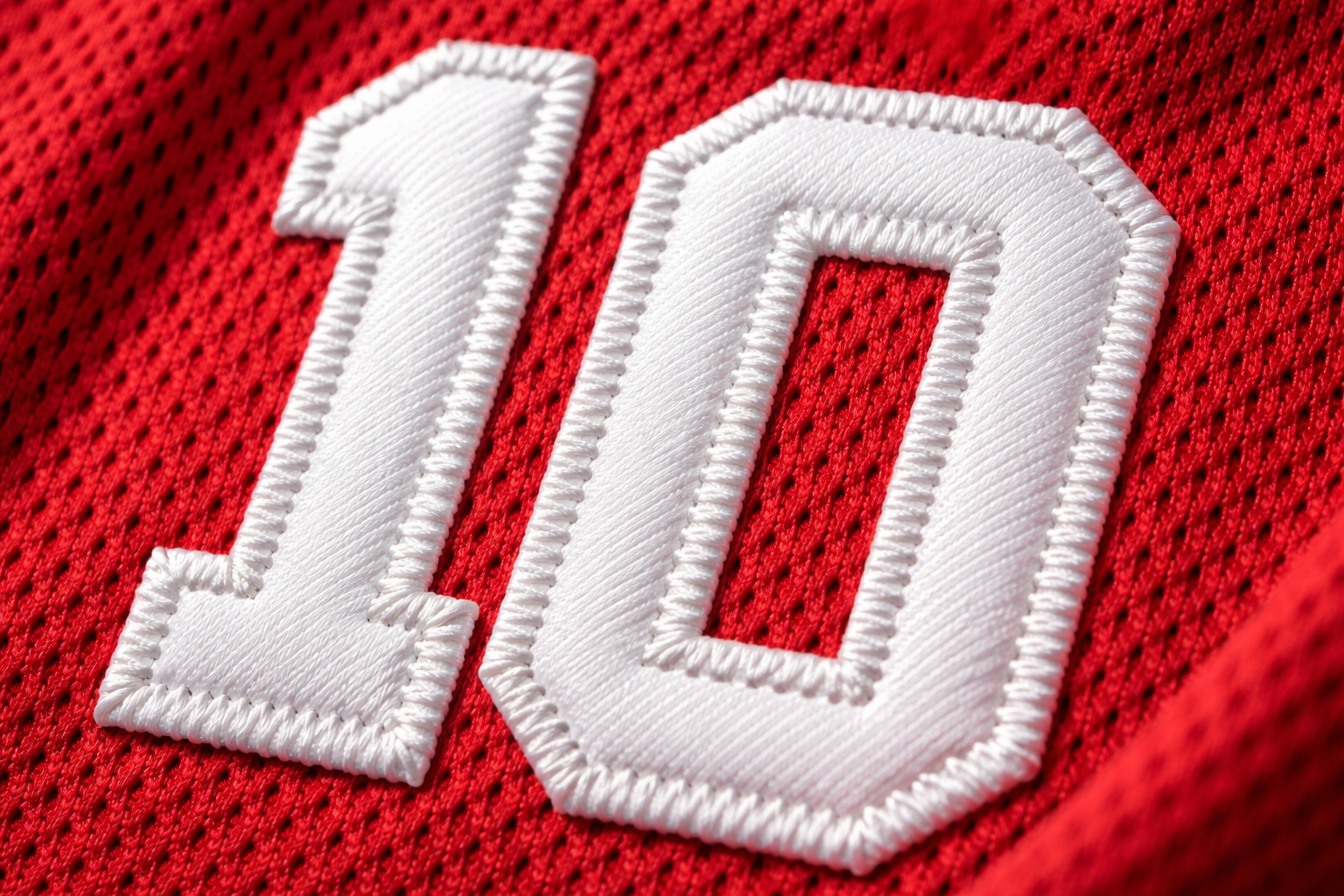 Youth Sports Jerseys: The Guide to Affordable Gear for Kids 3 Macro close up of stitched tackle twill numbers on a youth sports jersey to show durability.