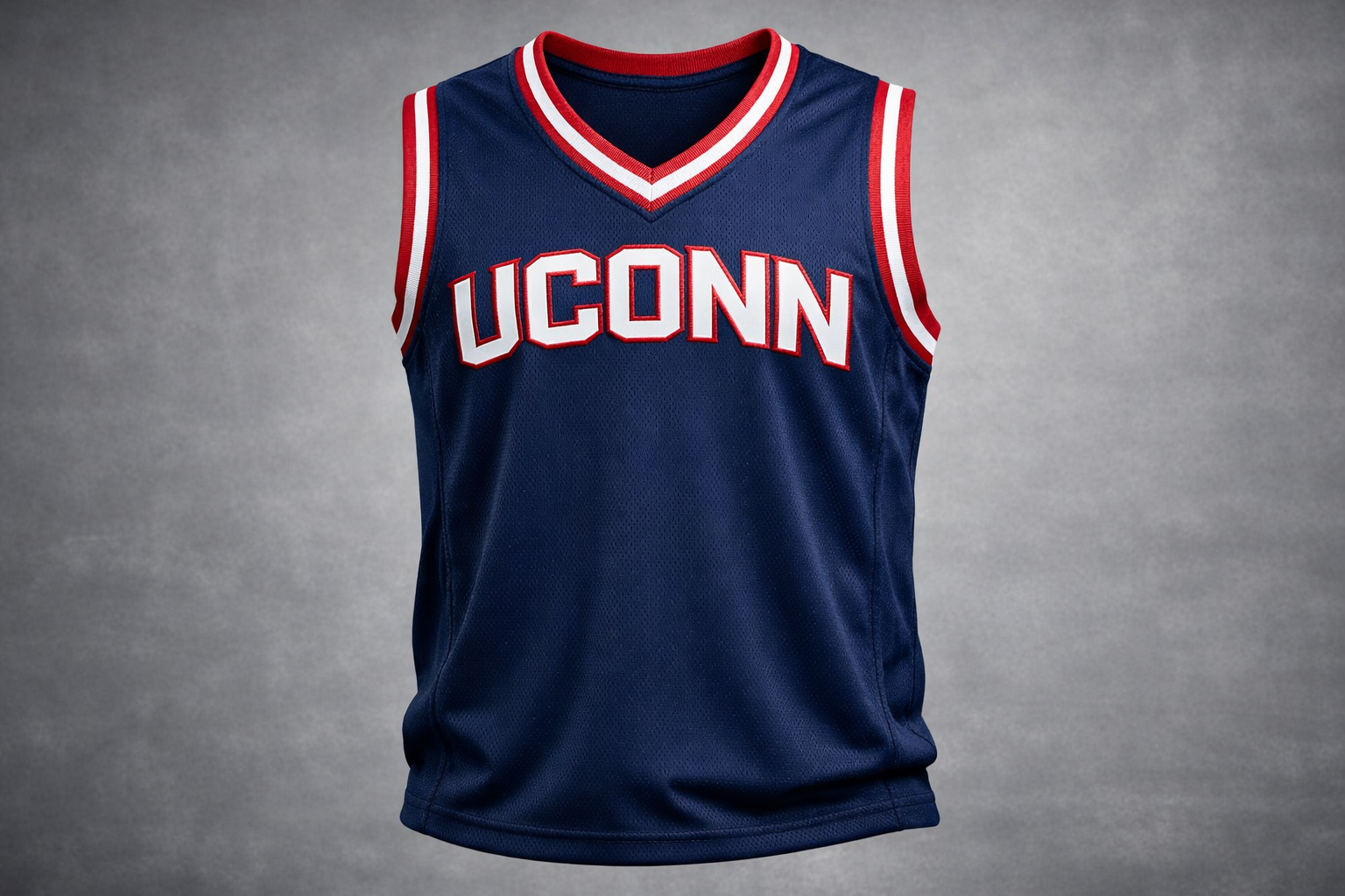 Navy blue UConn Huskies basketball jersey with white and red stitched lettering.