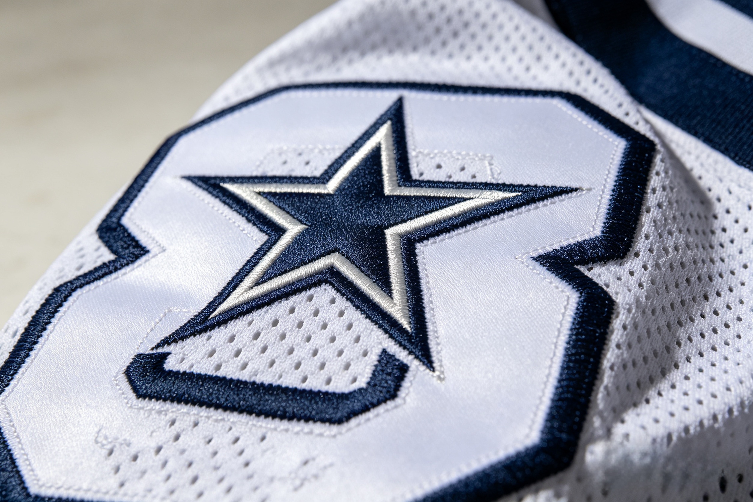 Detailed close-up of premium stitching on a CeeDee Lamb jersey