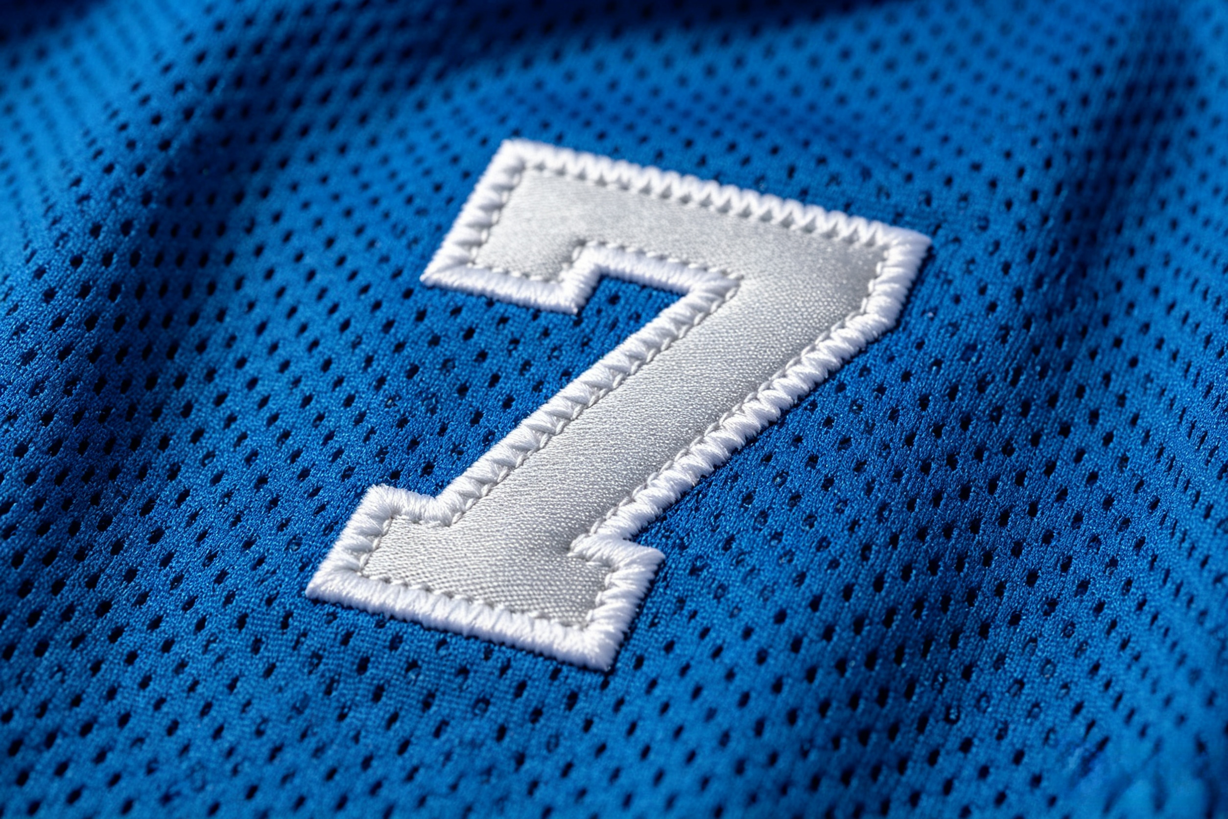 Close-up of premium stitched numbers on a Detroit Lions jersey