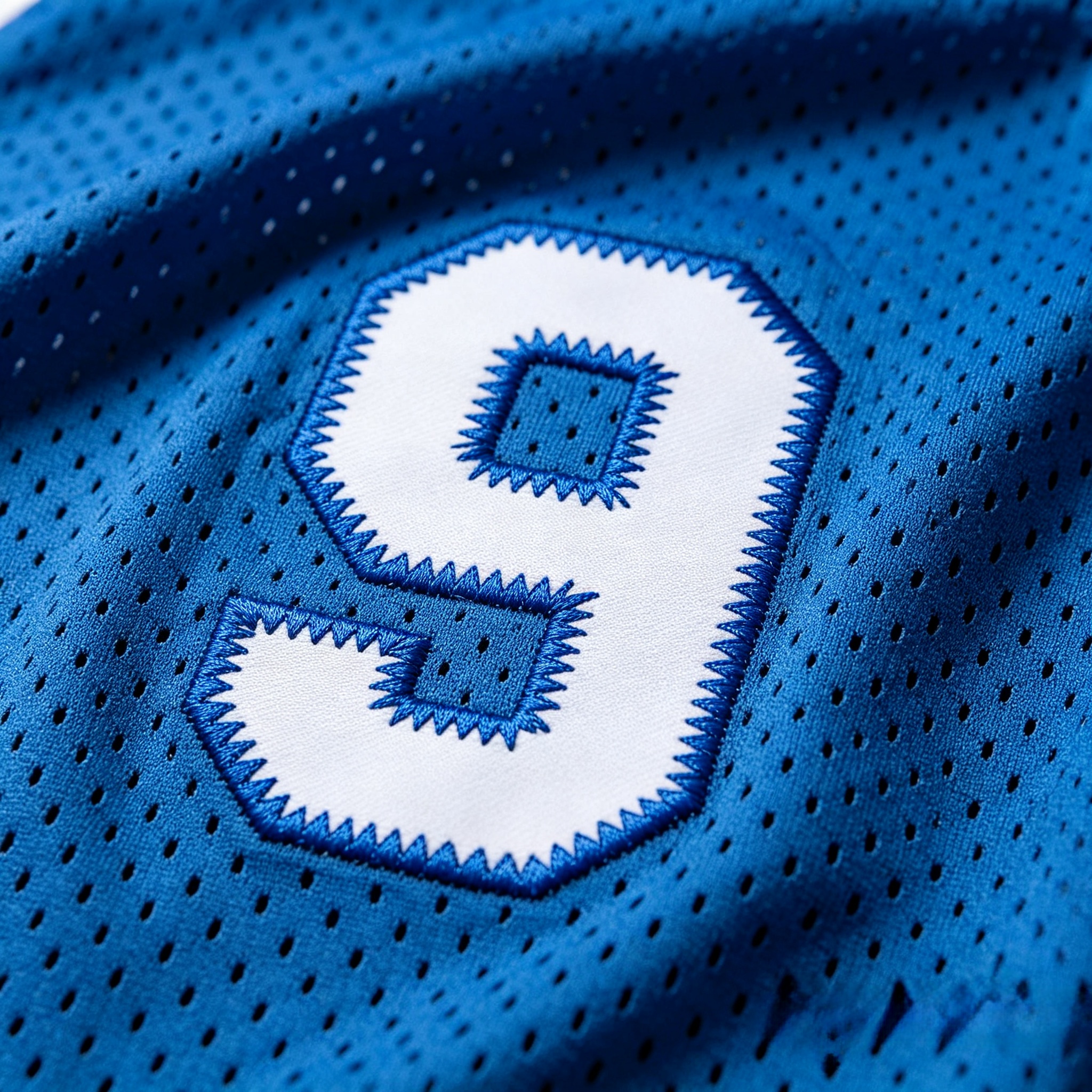 Close-up of premium tackle twill stitching on an NFL jersey number